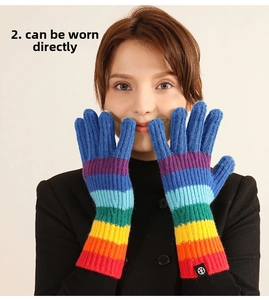 Detailed knit texture of colorful rainbow striped gloves with extended length design