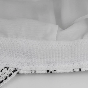 Macro shot showing internal lining, elastic band, and tweed fabric sewing details