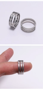 Close-up of silver stainless steel jump ring opener tool with three-slot design for DIY