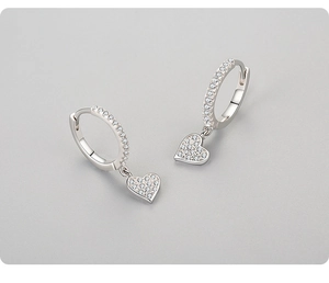 Close-up of S925 sterling silver heart earrings with sparkling white zircon stones