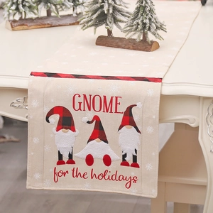 Christmas gnome table runner with buffalo plaid border and festive snowflake embroidery