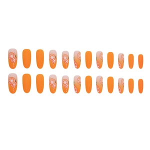 Oval matte orange fake nails with orange slice patterns and almond shape finish
