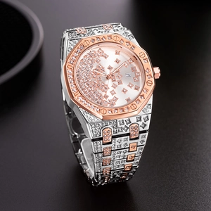 Macro shot of an octagonal luxury watch with diamond embellishments and two-tone metal finish