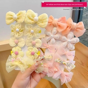 Detail of 20-piece set featuring yellow and pink bow flower hair clips for girls