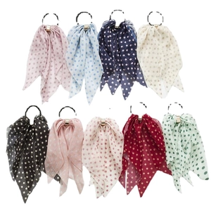 Chiffon polka dot bow scrunchies with gold buckles in various colors on white background