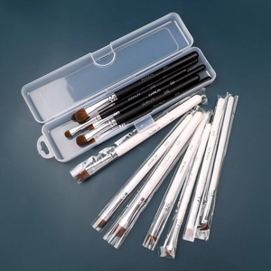 Transparent makeup brush storage case with professional black and white brushes