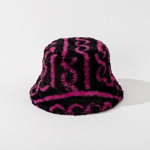 Close-up of fluffy faux fur bucket hat featuring black and pink wavy striped pattern