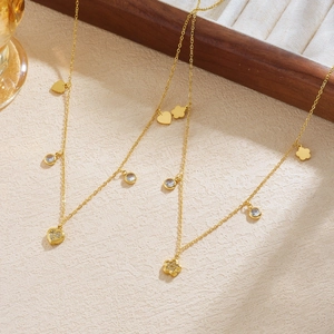 Gold-plated stainless steel necklace set featuring heart and floral pendants with zircon
