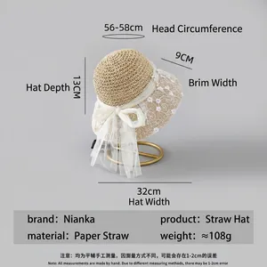 Elegant beige straw hat with floral lace embroidery and pearl bow for summer sun protection