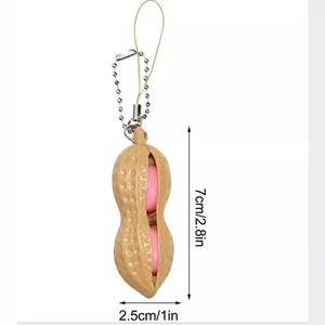 Giocattolo antistress a forma di arachide con portachiavi, squeeze toy da 7 cm
