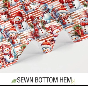 Close-up of the sewn bottom hem on a Christmas snowman pattern fabric shower curtain