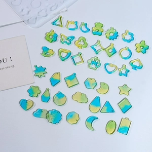Detail showing various resin pendants in gradients and their silicone casting molds