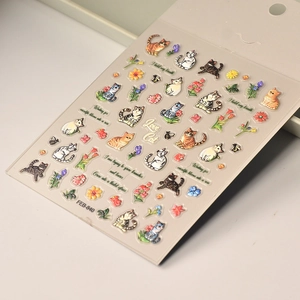 Detailed close-up of 5D embossed nail art stickers featuring cute 3D cats and floral patterns