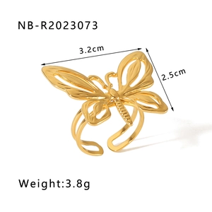 Detailed view of the 18k gold butterfly ring featuring intricate hollow engraving patterns