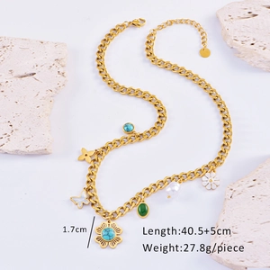 Detail of bohemian gold chunky chain with turquoise floral and pearl charms and size labels