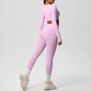 Side view of pink long sleeve crop top and high waist leggings for yoga and fitness