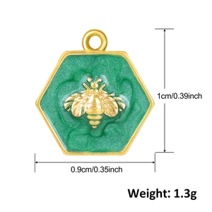 Detailed size view of a gold bee charm in a green hexagonal frame with 1cm height