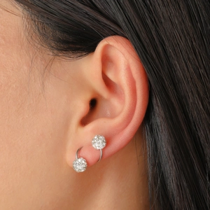 Elegant silver hoop earrings with a full crystal-encrusted Shamballa ball drop pendant