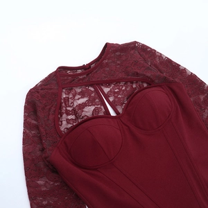 Detailed texture of burgundy lace corset top with cup pads and cutout design