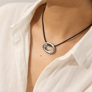 Irregular hollow oval stainless steel pendant necklace on black cord with minimalist style