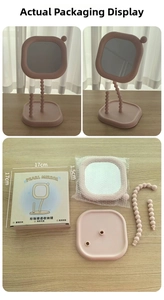Disassembled cream pink pearl makeup mirror showing base, mirror head, and packaging box.