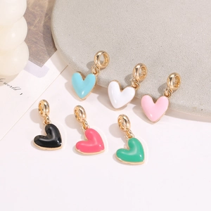 Detailed view of colorful heart enamel pendants in assorted pastel and vibrant tones