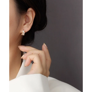 S925 sterling silver gold earrings with rectangular zircon on model in white suit