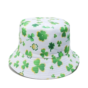 Close-up of Saint Patrick's Day bucket hat with green shamrock patterns on white canvas
