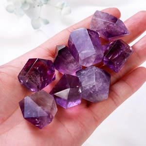 Natural purple amethyst crystal quartz points held in hand for home energy decor