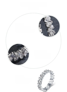 Macro detail of S925 sterling silver ring with alternating zircon stones and polished finish