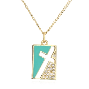 Detail of 18K gold-plated square pendant with green enamel and white cross inlay