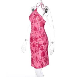 Detailed halter neck design of a pink floral print dress on a mannequin