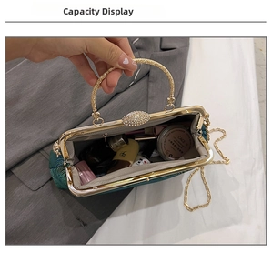 Capacity view of dark green peacock feather evening bag showing cosmetic storage