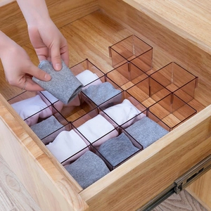Translucent amber drawer organizer for socks and underwear with modular square compartments