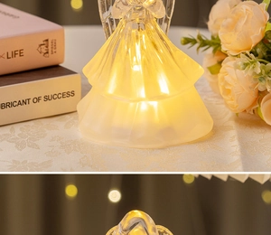 Detail of warm LED glowing crystal-like angel lamp on decorative indoor tabletop