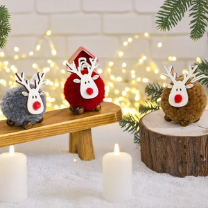 Handcrafted Christmas reindeer felt ball ornaments in grey, red, and brown on wood base