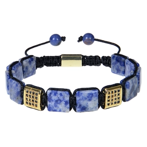 Macro detail of braided bracelet featuring blue natural stones and gold square beads