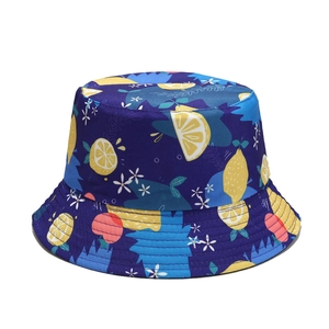 Reversible bucket hat with lemon and floral print in navy blue for sun protection