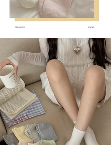 Close-up of assorted macaron colored cotton socks in a cozy lifestyle setting