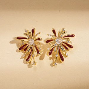 Golden flower earrings with red enamel firework petals and sparkling zircon accents