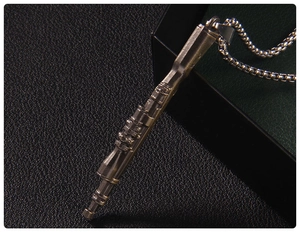 Detail shot of vintage bronze submachine gun pendant on a stylish textured background