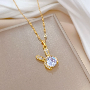 Luxury gold rabbit pendant necklace with large clear gemstone and pave crystal details