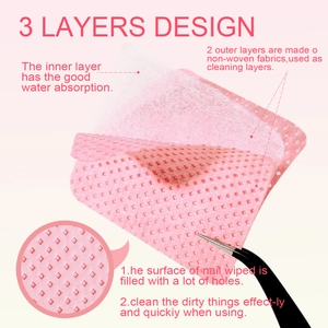 Macro detail of three-layer pink lint-free nail wipes with porous texture for cleaning