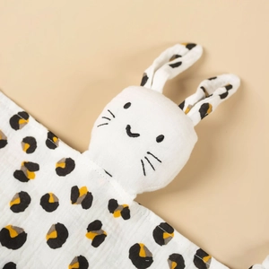 Detail of baby cotton gauze lovey showing soft breathable fabric texture and rabbit head