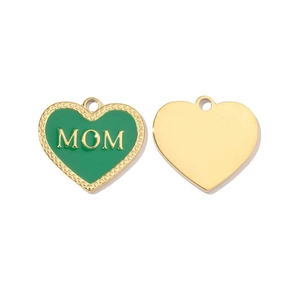 Detailed view of heart-shaped gold pendants with green enamel and MOM lettering