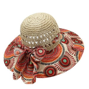 Bohemian straw sun hat for women featuring wide floral brim and a large side bow