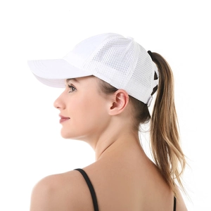 Side view of white mesh ponytail baseball cap showing the functional hair opening detail