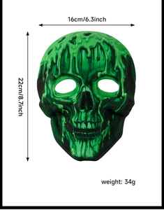 Front view of scary skull mask with green liquid detailing and 22cm x 16cm dimensions
