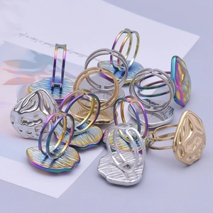 Minimalist stack of colorful geometric stainless steel rings in gold silver and rainbow
