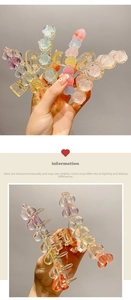 Detail of jelly colored heart and rose hair clips with transparent acrylic texture